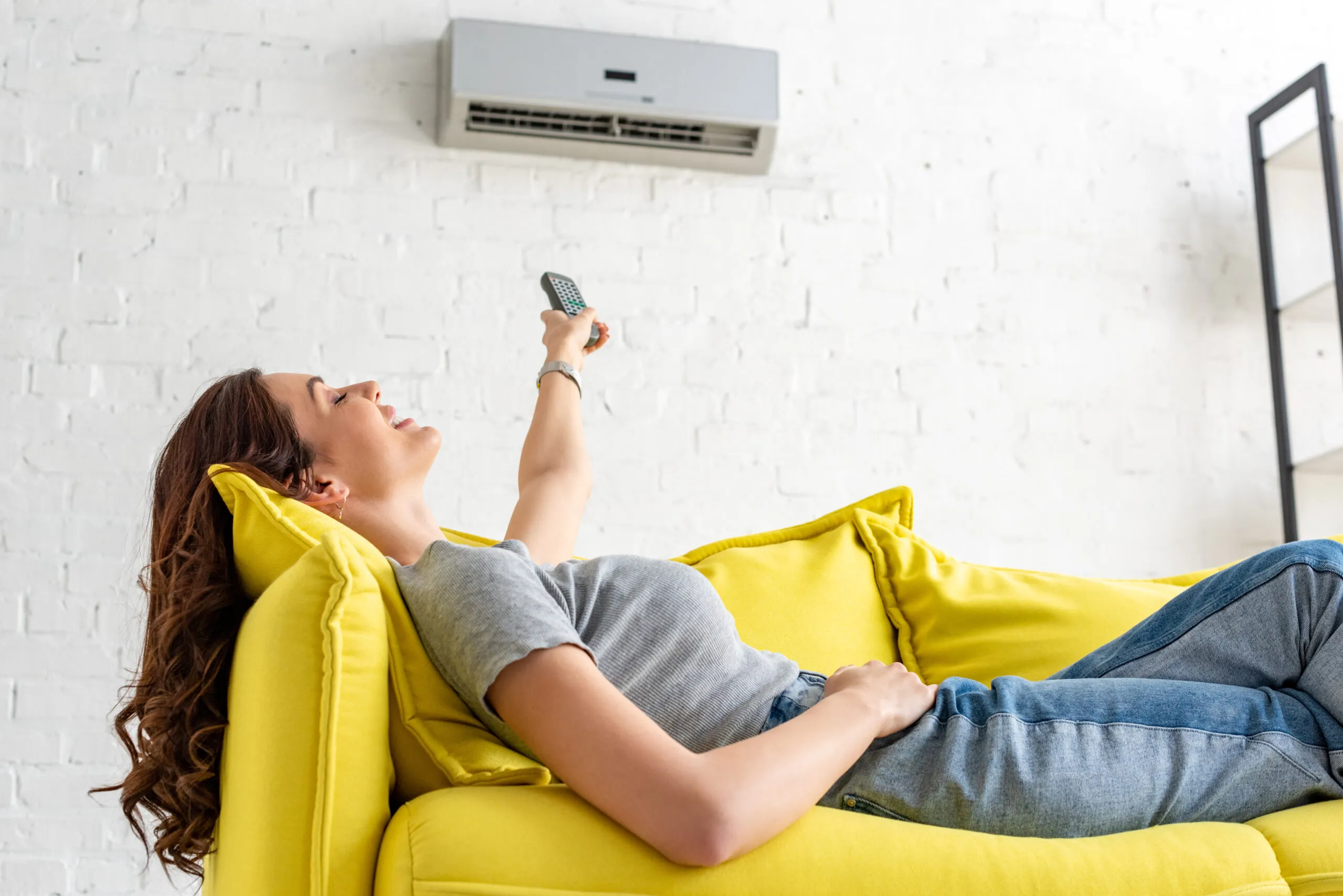 attractive-young-woman-relaxing-under-air-conditio-2021-08-30-01-46-53-utc-scaled.webp